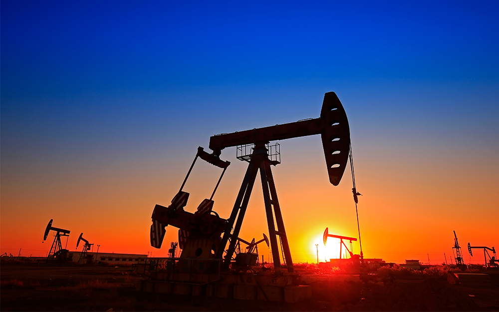 Crude oil pumps in a sunset mode.